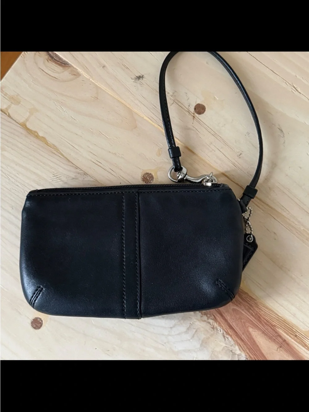 Coach, Soho, wristlet Black Leather Wristlet with Buckle Detail excellent condi
